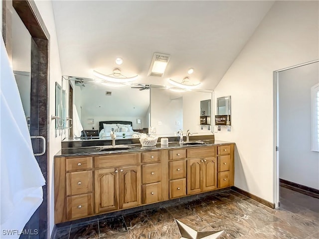 309 Donora Blvd, Fort Myers Beach, FL 33931 - bathroom with connected bathroom, a sink, baseboards, vaulted ceiling, and marble finish floor