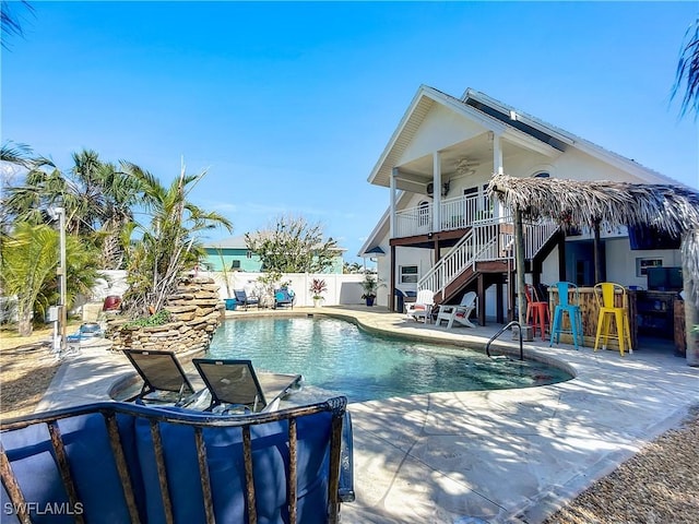 309 Donora Blvd, Fort Myers Beach, FL 33931 - view of swimming pool featuring a patio, ceiling fan, fence, a bar, and stairs