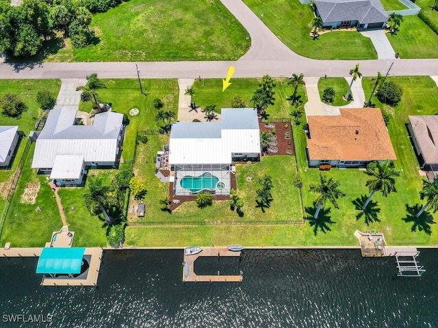 birds eye view of property featuring a water view