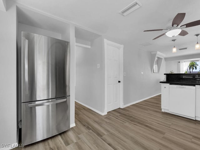 kitchen with white cabinets, ceiling fan, dishwasher, light hardwood / wood-style floors, and stainless steel refrigerator