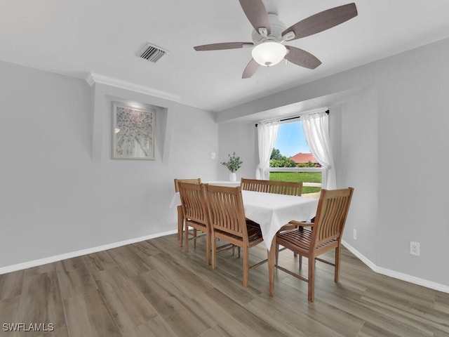 dining area featuring ceiling fan and hardwood / wood-style flooring