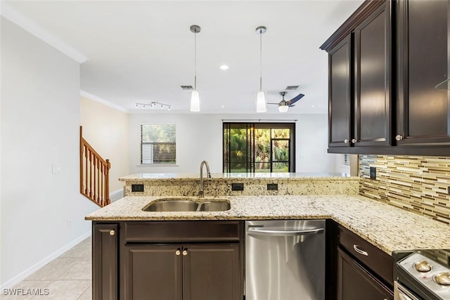 kitchen with light tile patterned floors, a sink, ornamental molding, appliances with stainless steel finishes, and tasteful backsplash