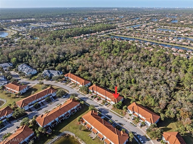 birds eye view of property featuring a residential view and a water view