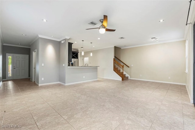 unfurnished living room featuring visible vents, baseboards, a ceiling fan, stairs, and crown molding