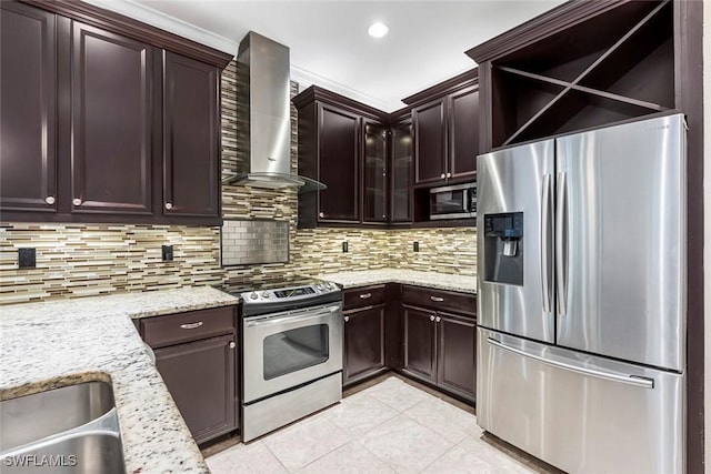 kitchen featuring light tile patterned flooring, wall chimney exhaust hood, tasteful backsplash, light stone counters, and stainless steel appliances