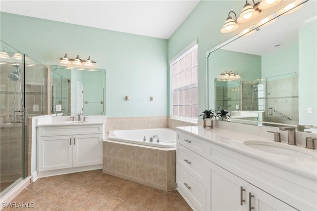 bathroom with tile patterned floors, vanity, and independent shower and bath