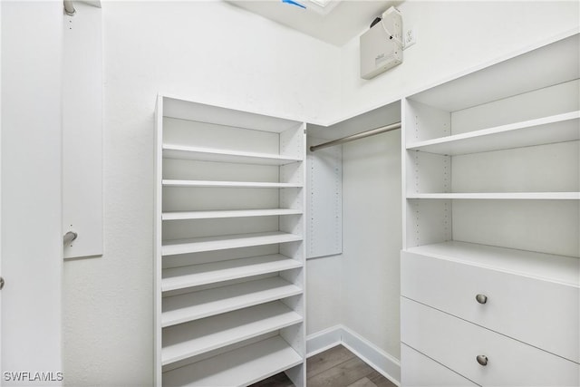 spacious closet featuring hardwood / wood-style floors