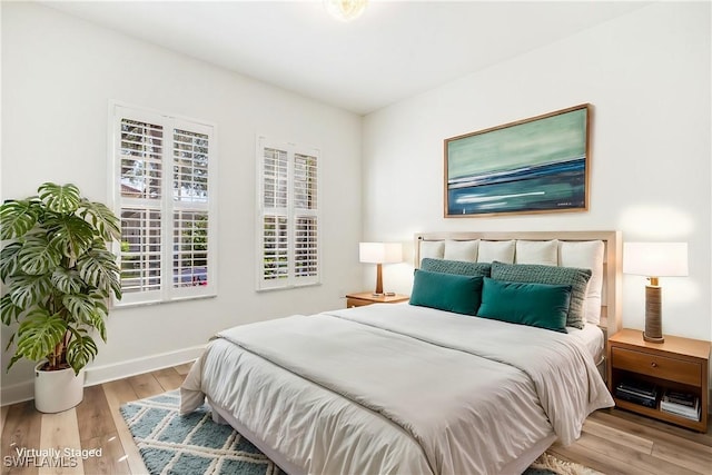 bedroom with light wood-type flooring