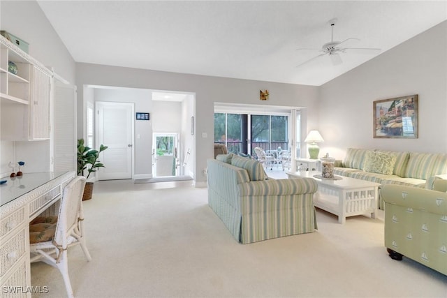 living room featuring light carpet, a wealth of natural light, ceiling fan, and lofted ceiling