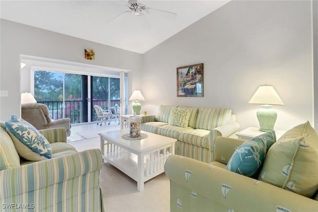 living room featuring ceiling fan, light colored carpet, and vaulted ceiling