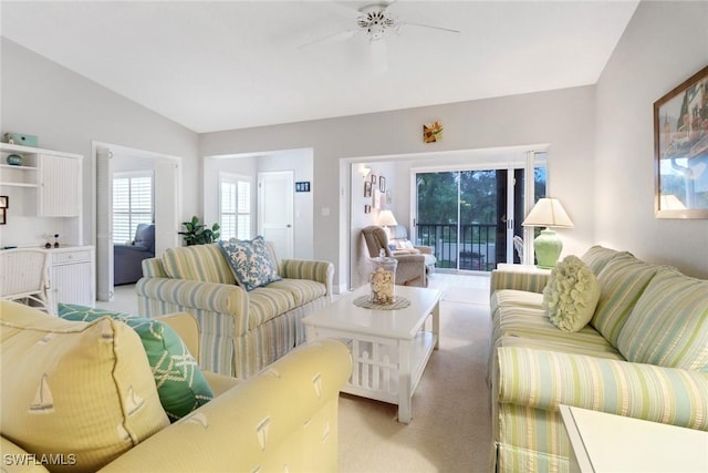 living room featuring light carpet, vaulted ceiling, and ceiling fan