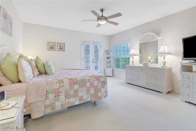 bedroom with ceiling fan and light carpet