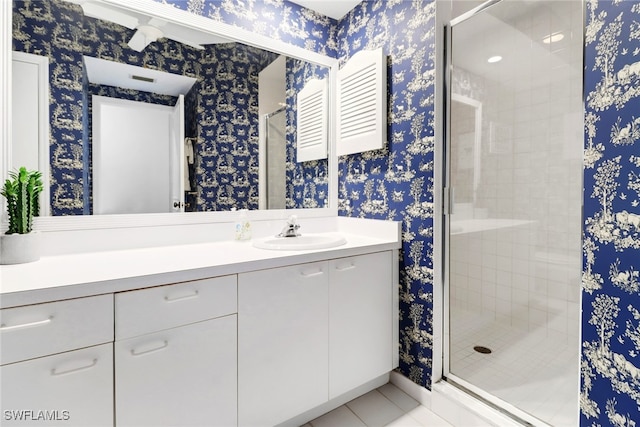 bathroom with tile patterned flooring, vanity, and an enclosed shower