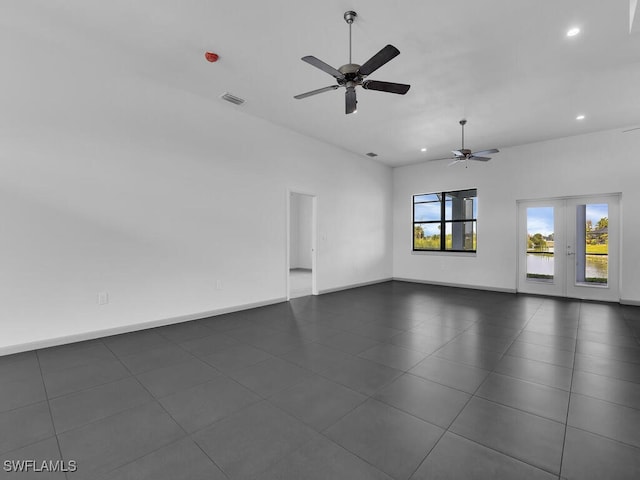 spare room featuring french doors and ceiling fan