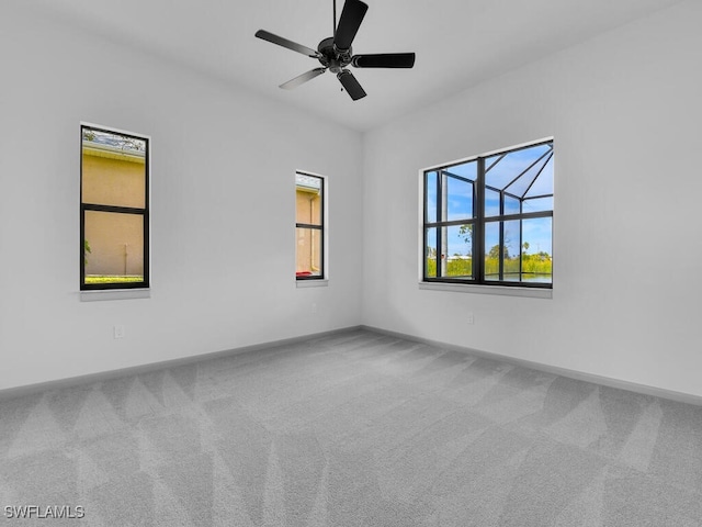 carpeted empty room with ceiling fan