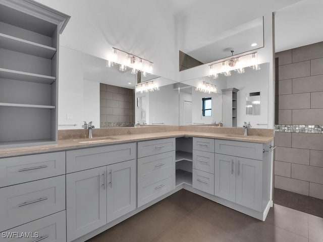 bathroom with tile walls, vanity, and tile patterned flooring