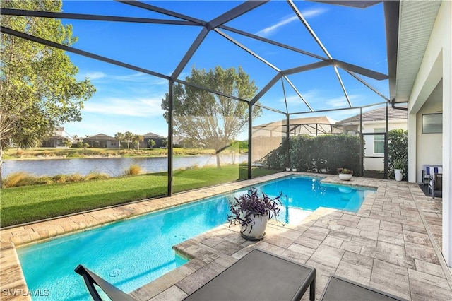 view of pool featuring a water view, glass enclosure, and a patio area