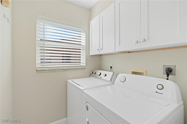 laundry room featuring cabinets and independent washer and dryer