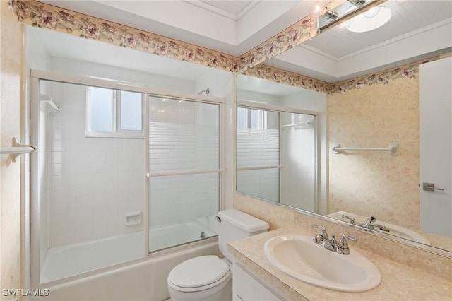 full bathroom with shower / bath combination with glass door, vanity, and toilet