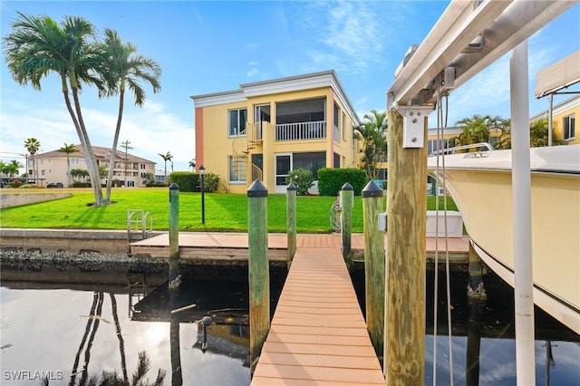 view of dock featuring a yard