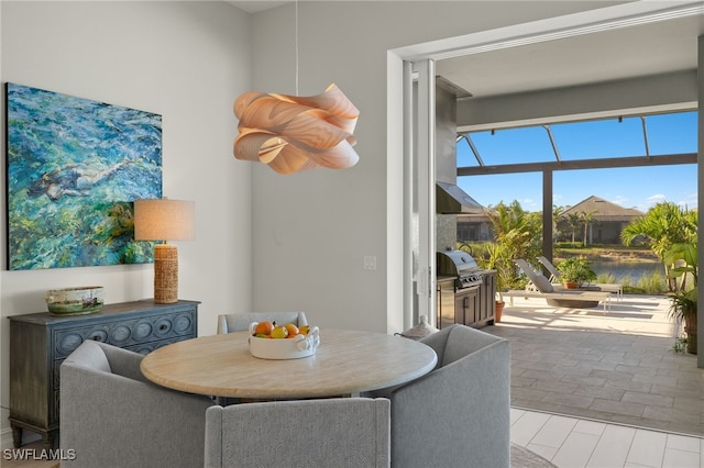 dining space featuring a water view