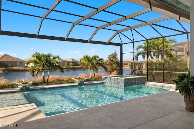 view of pool with a lanai, pool water feature, a patio area, an in ground hot tub, and a water view