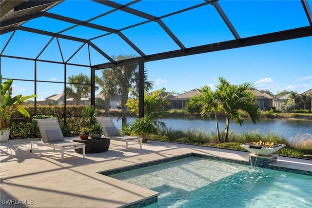 view of pool featuring a lanai, a patio area, pool water feature, and a water view