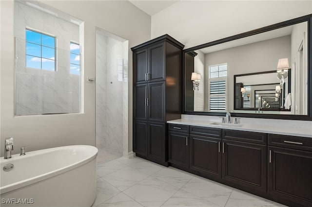 bathroom with vanity and a tub to relax in