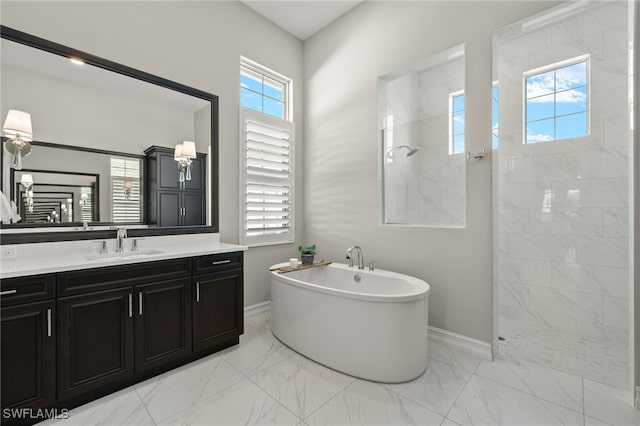 bathroom featuring shower with separate bathtub, vanity, and plenty of natural light