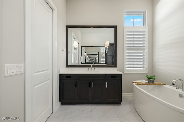 bathroom featuring a tub and vanity