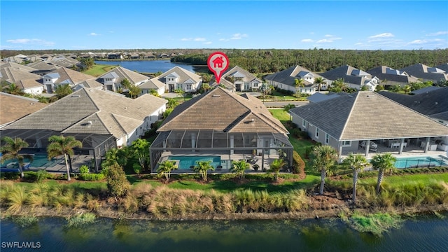 birds eye view of property featuring a water view