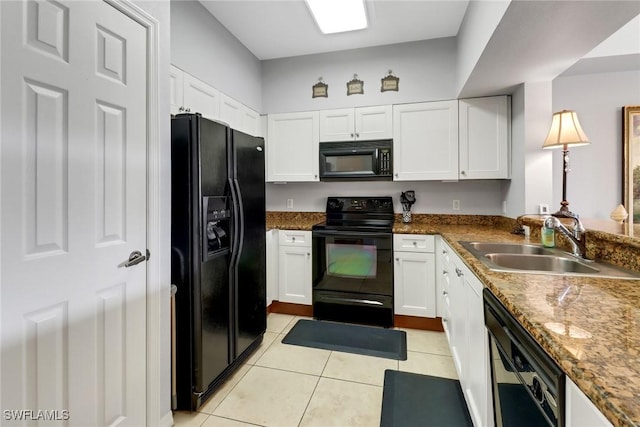 kitchen with black appliances, white cabinetry, sink, and light tile patterned floors