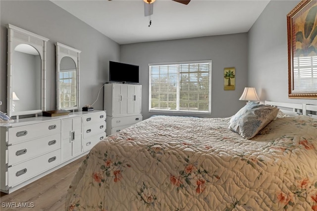 bedroom with wood-type flooring and ceiling fan