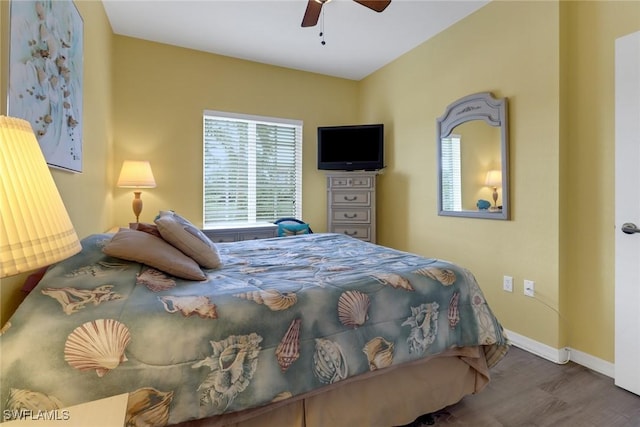 bedroom with ceiling fan and wood-type flooring