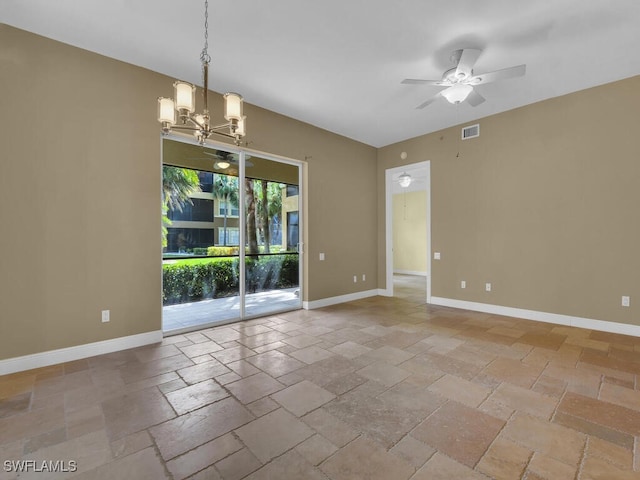 unfurnished room featuring ceiling fan with notable chandelier