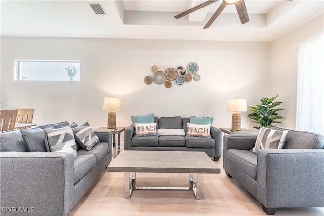 living room with ceiling fan and light hardwood / wood-style floors