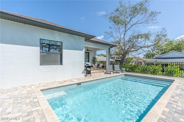 view of swimming pool featuring a patio area