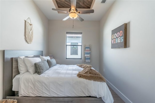 bedroom with ceiling fan and wood-type flooring