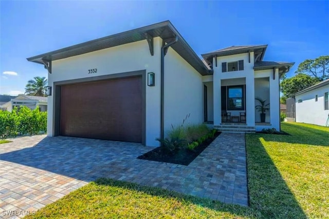 modern home with a garage and a front lawn