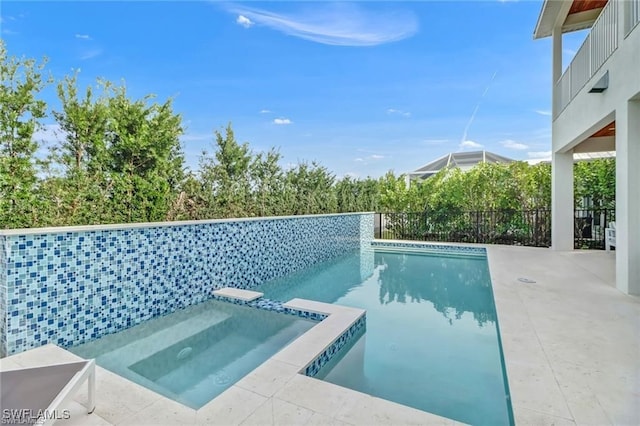 view of swimming pool featuring a pool with connected hot tub