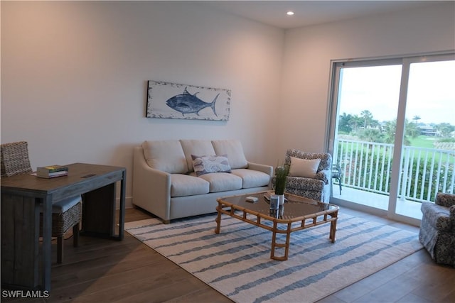 living area with recessed lighting and wood finished floors