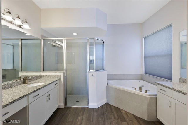 11727 Kati Falls Ln, Fort Myers, FL 33913 - bathroom featuring vanity, a bath, a shower stall, and wood finished floors