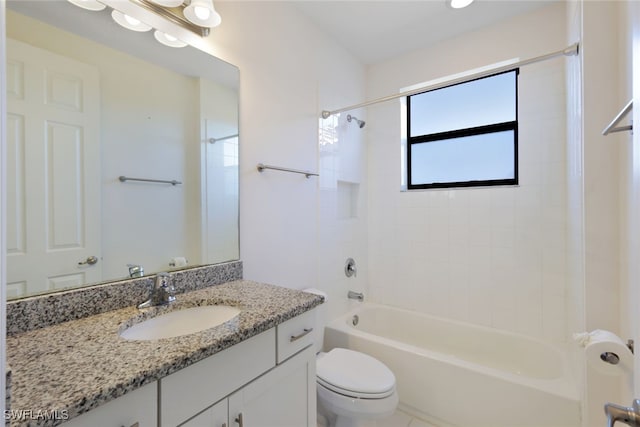 full bathroom with toilet, vanity, and bathing tub / shower combination