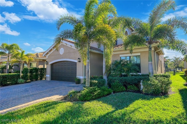 mediterranean / spanish house with a garage