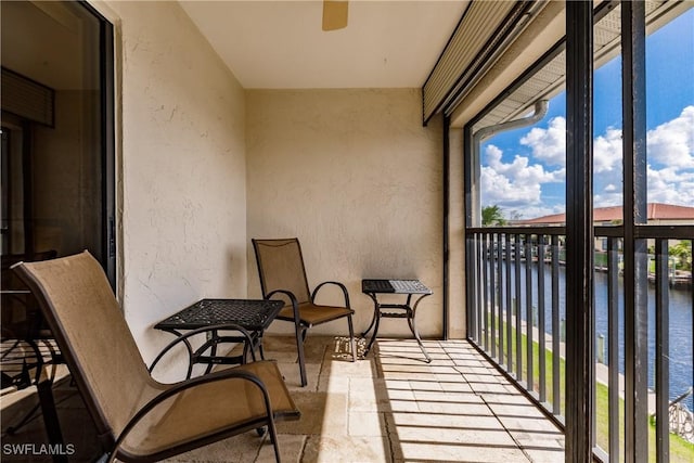 balcony featuring a water view