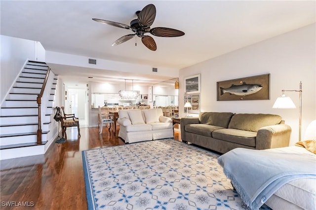 living room with ceiling fan and hardwood / wood-style flooring