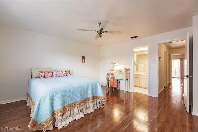 bedroom with ceiling fan, dark hardwood / wood-style flooring, and ensuite bathroom