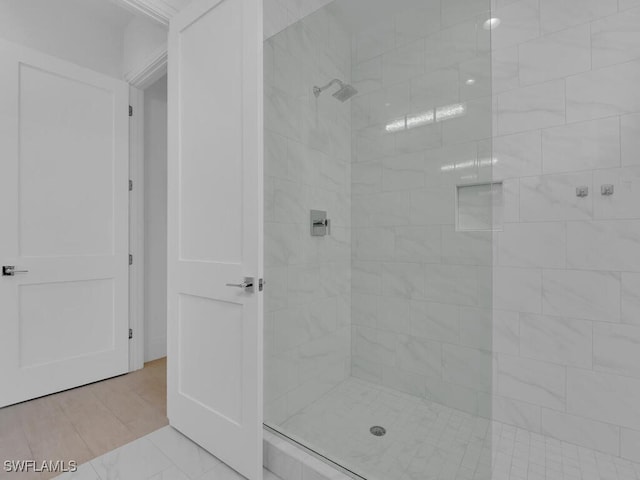 bathroom with a tile shower