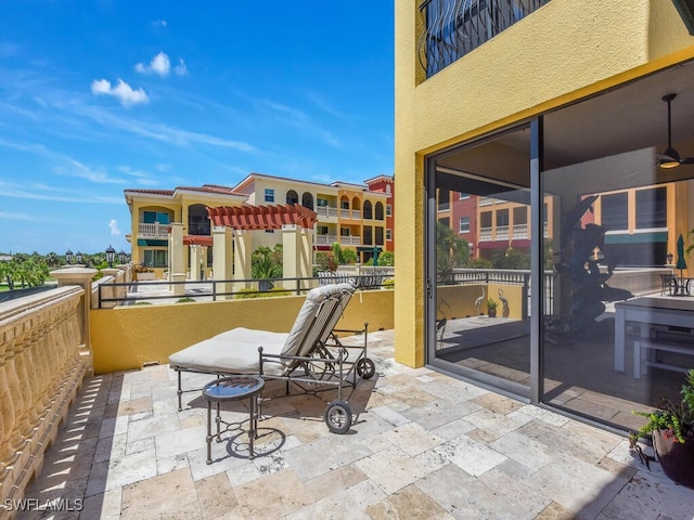 view of patio / terrace featuring a balcony and ceiling fan