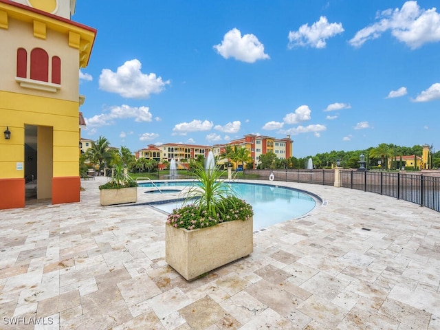 view of swimming pool featuring a patio area